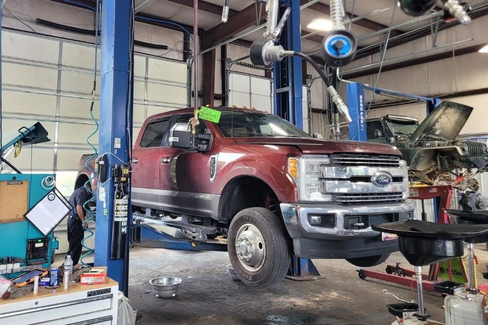 Ford Super Duty truck on lift during diesel diagnostics. Diesel Diagnostics, Diesel Repair In Jamestown TN At Independent Auto and Diesel Repair