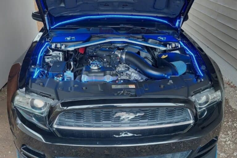 Back-to-School Vehicle Maintenance in Jamestown, TN At Independent Auto and Diesel Repair. Vehicle with open hood in auto repair shop during maintenance service