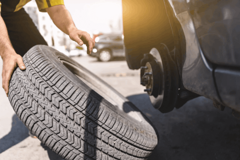 Tire replacement by Independent Auto and Diesel Repair in Jamestown, TN. Image of a technician removing a tire from a vehicle to support safe traction and reliable fall driving.